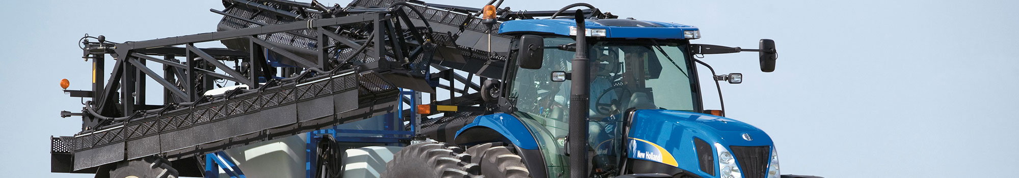 New Holland tractor and pull type sprayer